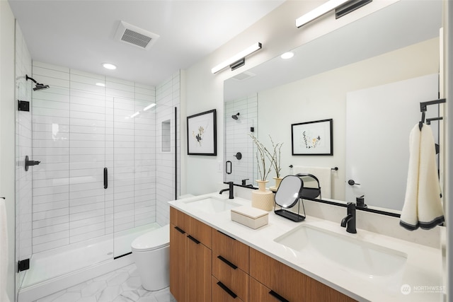 bathroom with walk in shower, vanity, and toilet