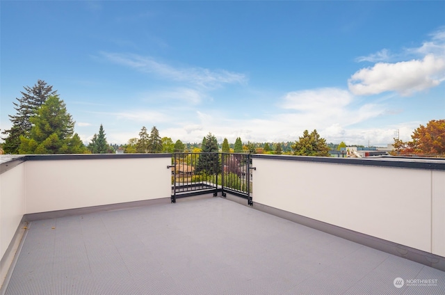 view of patio featuring a balcony