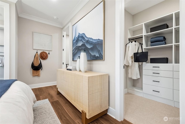 bedroom with ornamental molding, dark hardwood / wood-style flooring, and a closet