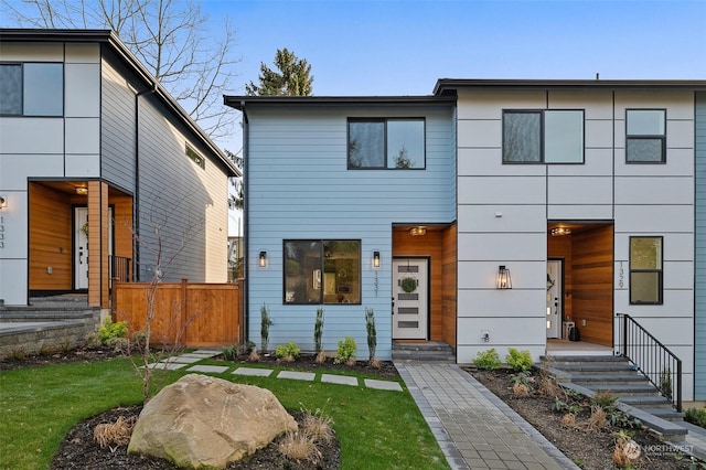 modern home featuring a front yard