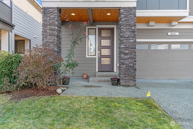 doorway to property with a garage