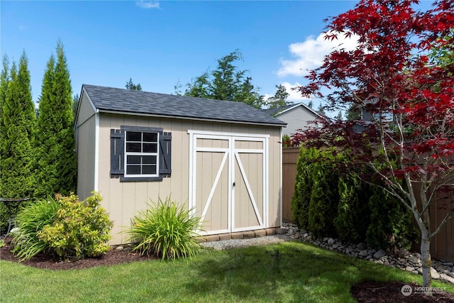 view of outdoor structure with a lawn