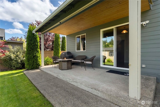 view of patio / terrace featuring an outdoor fire pit