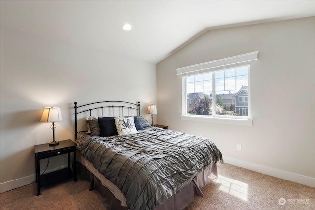 carpeted bedroom with vaulted ceiling