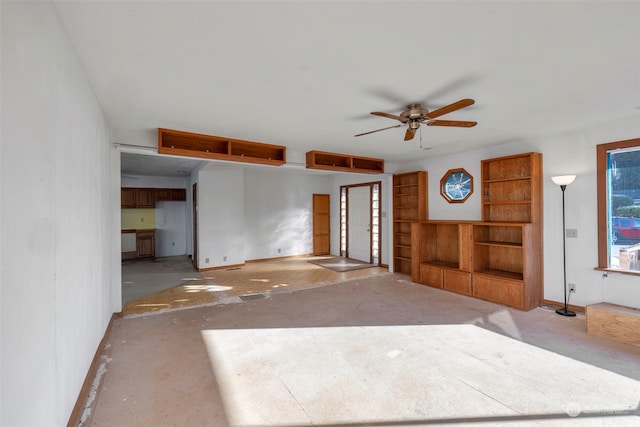 unfurnished living room featuring ceiling fan