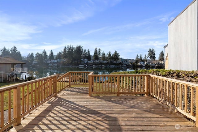 wooden deck featuring a water view