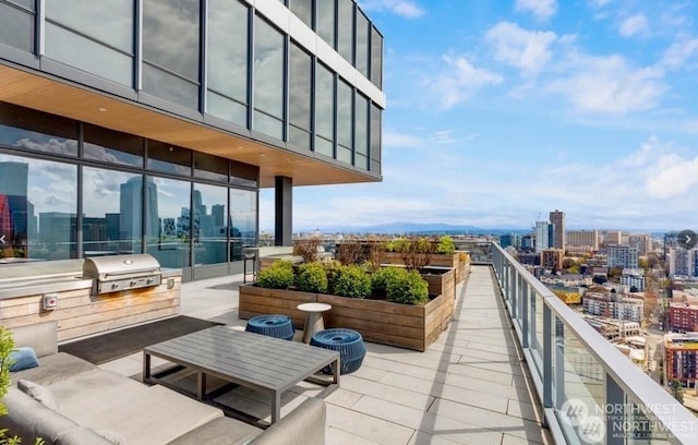 balcony featuring area for grilling and a grill