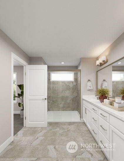 bathroom with vanity and tiled shower