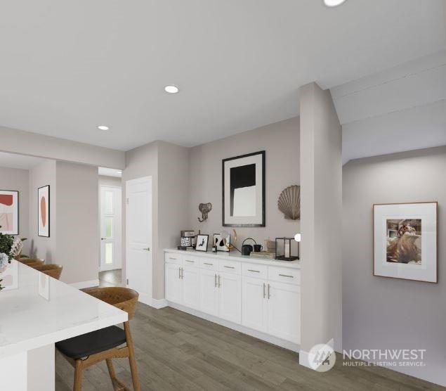 kitchen featuring white cabinets and dark hardwood / wood-style flooring