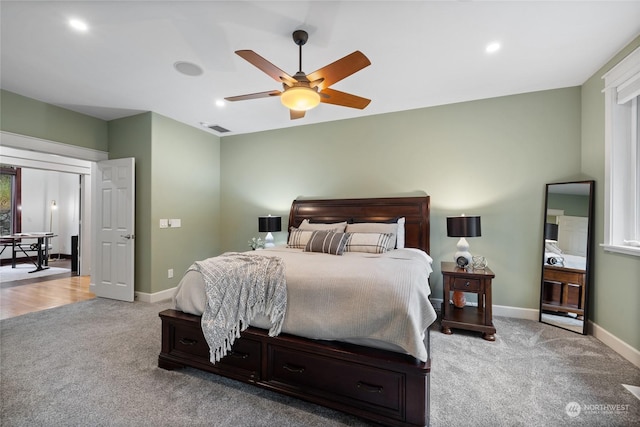 carpeted bedroom with ceiling fan