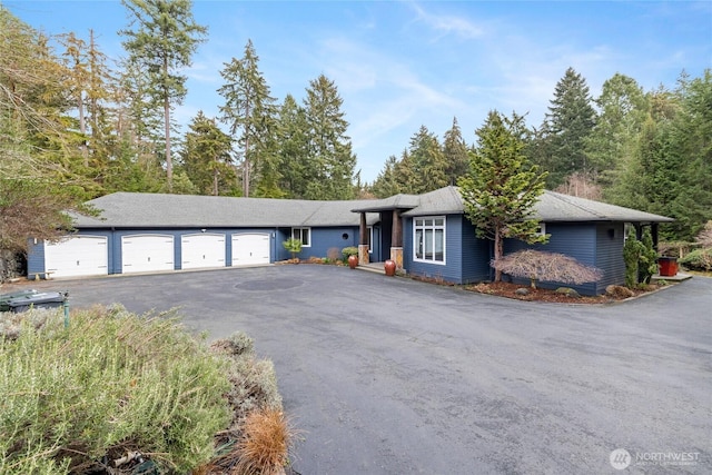 ranch-style house featuring a garage