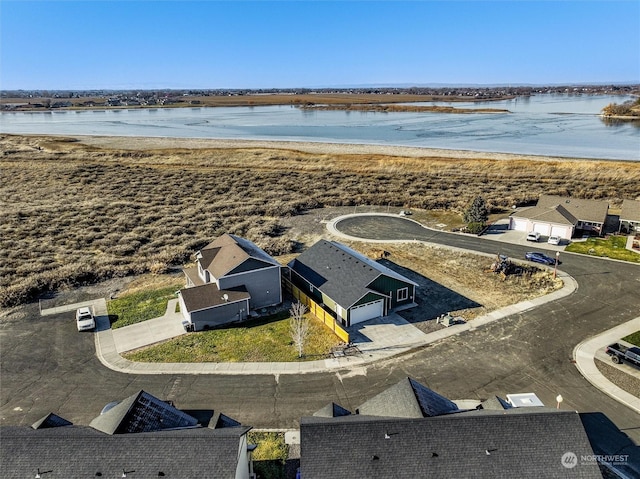 bird's eye view with a water view