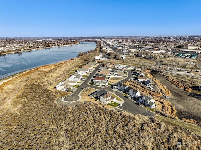 birds eye view of property featuring a water view