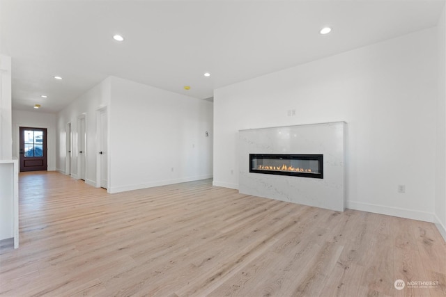 unfurnished living room featuring light hardwood / wood-style flooring