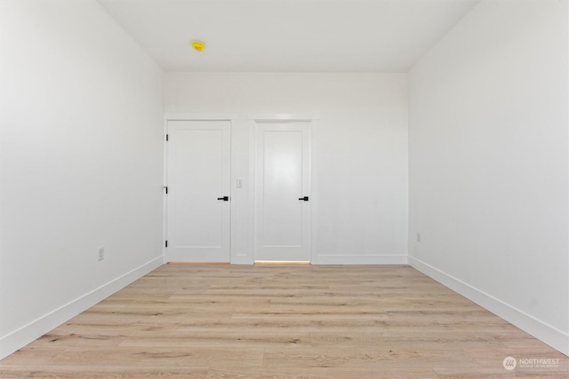 unfurnished room featuring light hardwood / wood-style floors