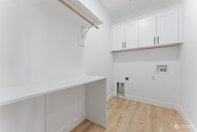 washroom with cabinets, washer hookup, light wood-type flooring, and electric dryer hookup