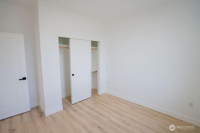 1300 Marina Dr Unit 12, Moses Lake, WA 98837 - unfurnished bedroom with a closet, baseboards, and wood finished floors