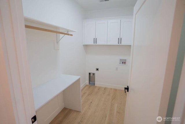 1300 Marina Dr Unit 12, Moses Lake, WA 98837 - laundry area with visible vents, washer hookup, light wood-style floors, cabinet space, and electric dryer hookup