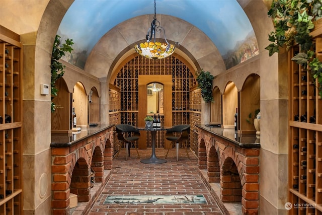 wine room featuring lofted ceiling