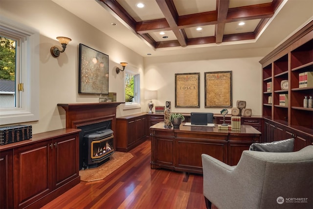 office with coffered ceiling, dark hardwood / wood-style floors, beam ceiling, and a wood stove