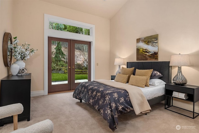 carpeted bedroom with french doors, high vaulted ceiling, and access to outside