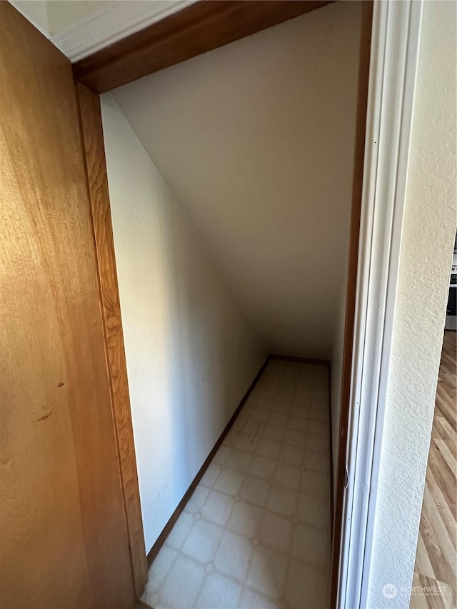 hallway with vaulted ceiling