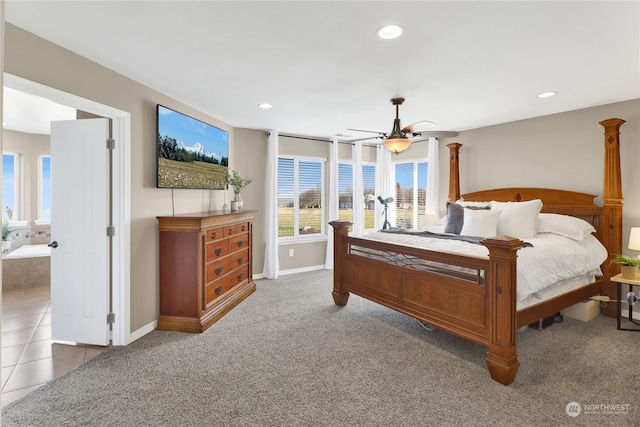 bedroom with carpet floors, decorative columns, and ceiling fan