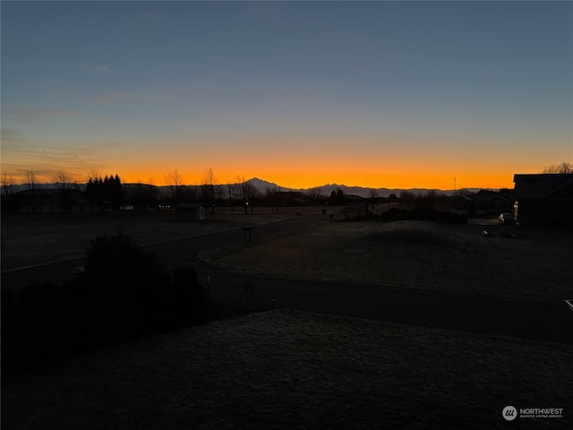 yard at dusk with a mountain view