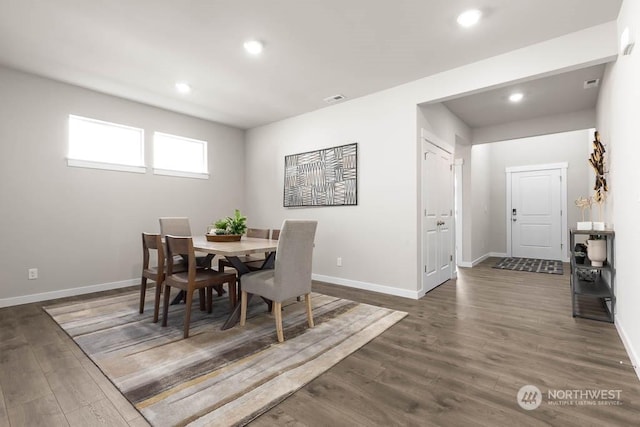 dining space with recessed lighting, baseboards, dark wood finished floors, and visible vents