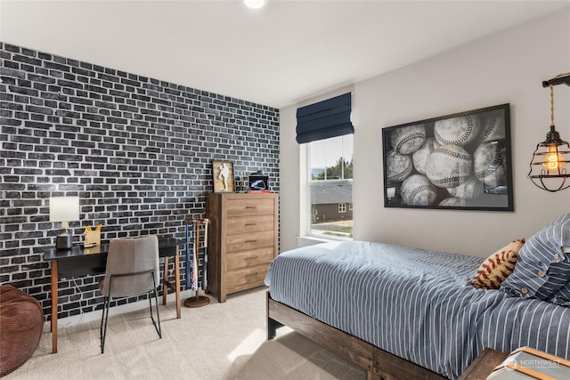 bedroom featuring carpet floors and brick wall