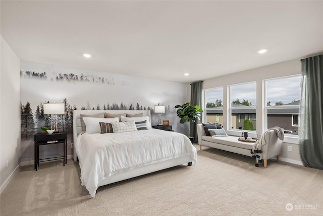 bedroom with light colored carpet, recessed lighting, and baseboards