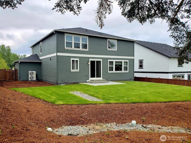 back of house featuring a yard and fence