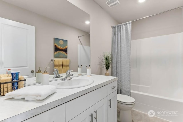 full bathroom featuring shower / bathtub combination with curtain, vanity, and toilet