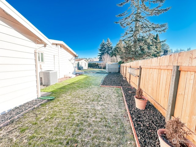 view of yard featuring central AC unit