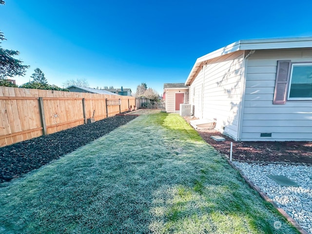 view of yard with central AC unit