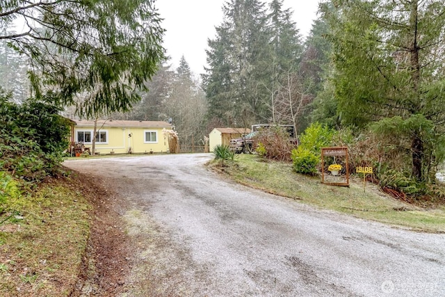 view of front of house with a shed