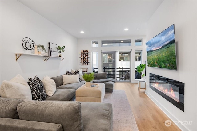 living room with light hardwood / wood-style flooring