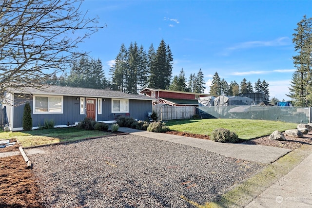 ranch-style house with a front lawn