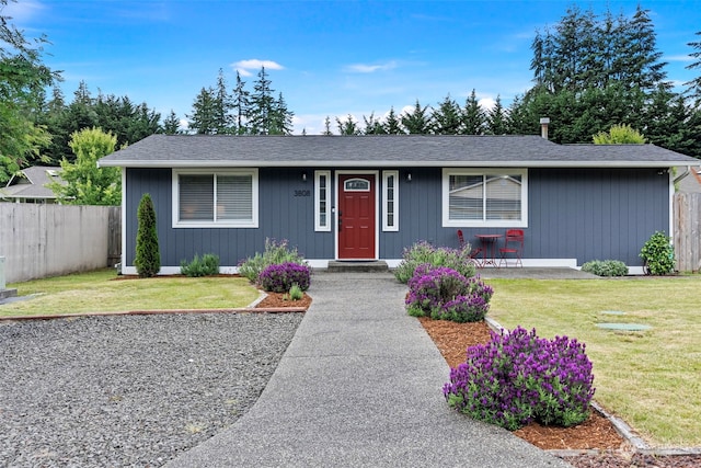 ranch-style house with a front yard