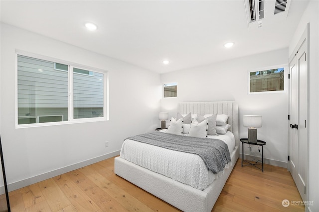 bedroom with hardwood / wood-style flooring