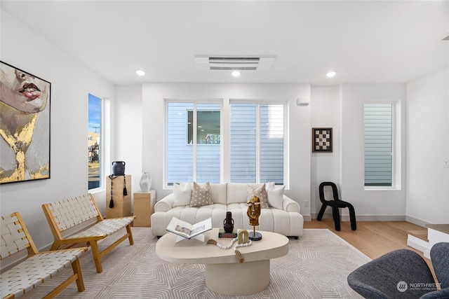 living room with light hardwood / wood-style floors