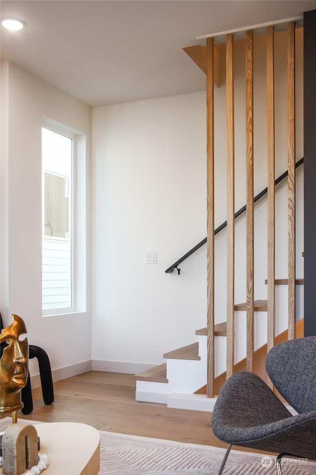 staircase featuring hardwood / wood-style flooring