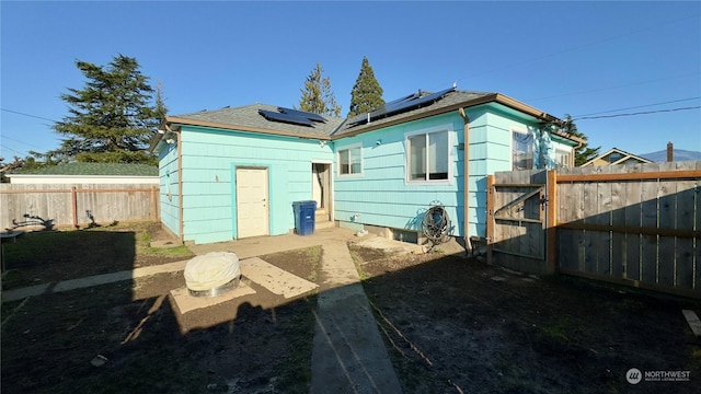 back of property with solar panels