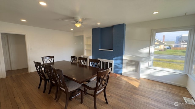 dining area featuring hardwood / wood-style floors and ceiling fan