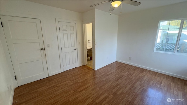 unfurnished bedroom with wood-type flooring and ceiling fan