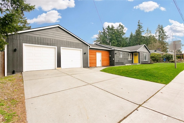 single story home with a garage and a front yard