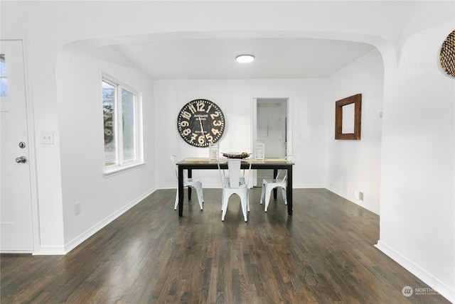 unfurnished dining area featuring dark hardwood / wood-style flooring