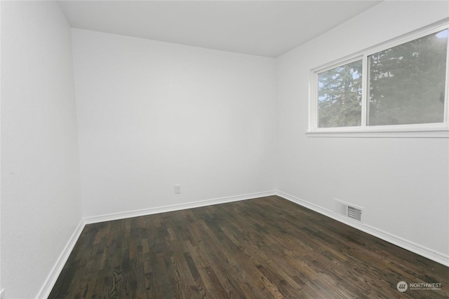 empty room featuring dark hardwood / wood-style floors