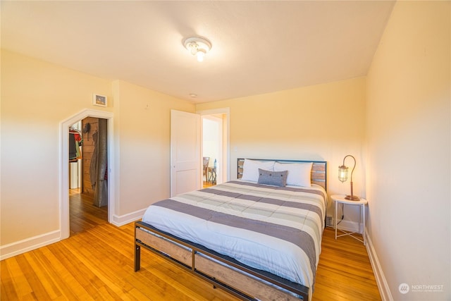 bedroom with light wood-type flooring