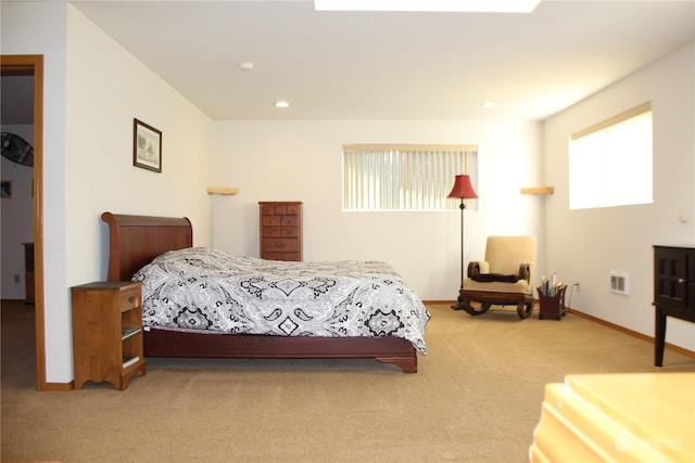 bedroom with light colored carpet